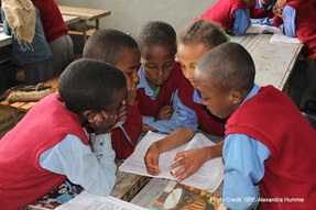 Children crowd to work together in class, Ethiopia