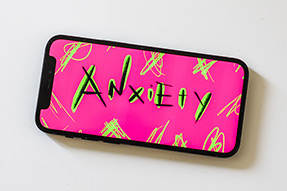 Blog post - Top tips to help deal with feelings of anxiety Anxiety handlettering on a smartphone screen